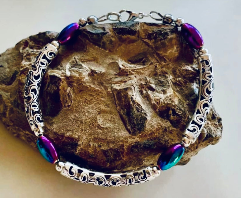 Rainbow Hematite/Curved Spacer Bracelet