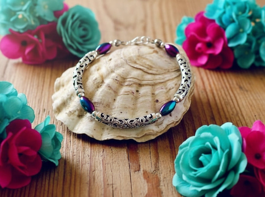 Rainbow Hematite/Curved Spacer Bracelet