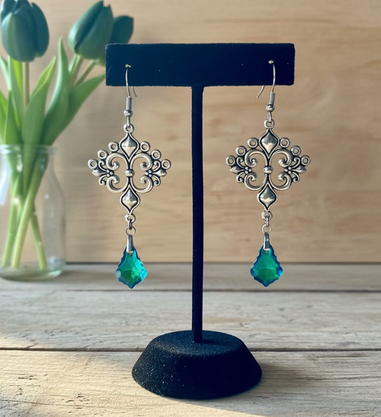 Ornate Patterned Connectors with Green Teardrop Green Light-Reflecting Drops