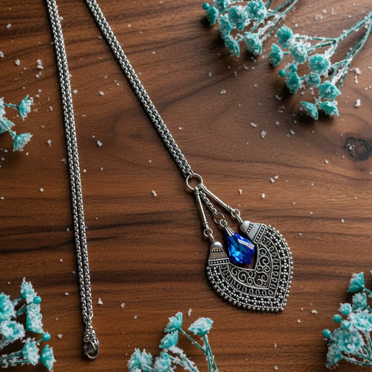 Patterned Pendant with Teardrop Light-Reflecting Crystal